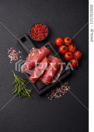 Meat, ham, jamon, or prosciutto sliced for breakfast bruschetta. Sliced ham, jamon, or prosciutto 135763800