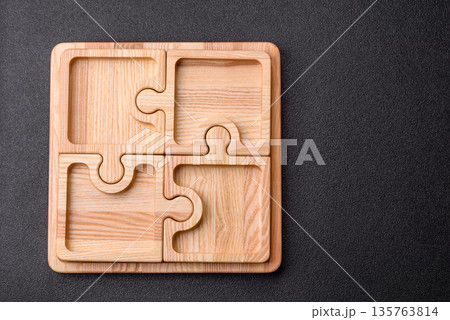 Wooden empty puzzle serving tray, kitchen accessories. A wooden empty puzzle tray Wooden empty puzzle serving tray, kitchen accessories. A wooden empty puzzle tray 135763814