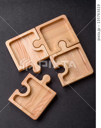Wooden empty puzzle serving tray, kitchen accessories. A wooden empty puzzle tray Wooden empty puzzle serving tray, kitchen accessories. A wooden empty puzzle tray 135763819