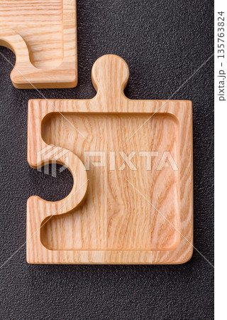 Wooden empty puzzle serving tray, kitchen accessories. A wooden empty puzzle tray 135763824