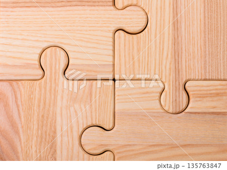 A wooden empty puzzle piece for a sign or business concept. A wooden empty puzzle A wooden empty puzzle piece for a sign or business concept. A wooden empty puzzle 135763847