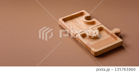 Wooden empty puzzle serving tray, kitchen accessories. A wooden empty puzzle tray Wooden empty puzzle serving tray, kitchen accessories. A wooden empty puzzle tray 135763860