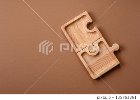 Wooden empty puzzle serving tray, kitchen accessories. A wooden empty puzzle tray 135763861