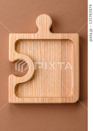 Wooden empty puzzle serving tray, kitchen accessories. A wooden empty puzzle tray Wooden empty puzzle serving tray, kitchen accessories. A wooden empty puzzle tray 135763874