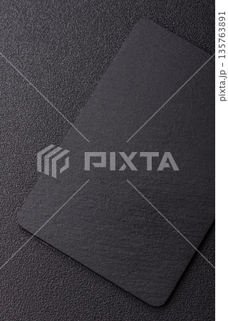 A black slate stone board or plate, an empty kitchen utensil. A black slate board 135763891