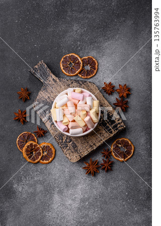 Mini marshmallows in white, pink, and pastel colors. Marshmallows as a food background 135763994