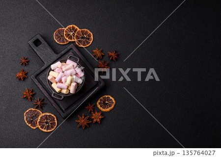 Mini marshmallows in white, pink, and pastel colors. Marshmallows as a food background 135764027
