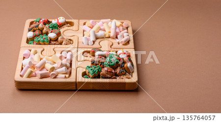 Mini marshmallows in white, pink, and pastel colors. Marshmallows as a food background Mini marshmallows in white, pink, and pastel colors. Marshmallows as a food background 135764057
