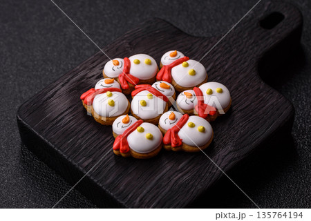 Gingerbread, Christmas cookies, and ornamental holiday baked goods. Christmas gingerbread Gingerbread, Christmas cookies, and ornamental holiday baked goods. Christmas gingerbread 135764194