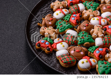 Gingerbread, Christmas cookies, and ornamental holiday baked goods. Christmas gingerbread Gingerbread, Christmas cookies, and ornamental holiday baked goods. Christmas gingerbread 135764213