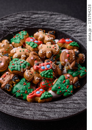 Gingerbread, Christmas cookies, and ornamental holiday baked goods. Christmas gingerbread Gingerbread, Christmas cookies, and ornamental holiday baked goods. Christmas gingerbread 135764228
