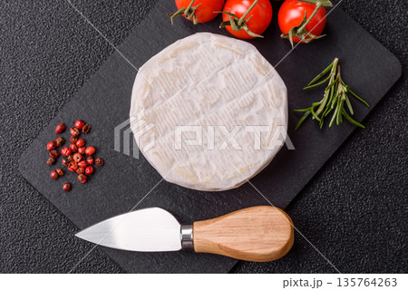 White French cream cheese Brie or Camembert for breakfast. Brie or Camembert cheese 135764263