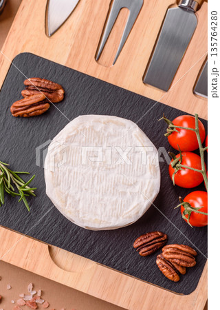 White French cream cheese Brie or Camembert for breakfast. Brie or Camembert cheese 135764280