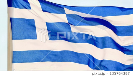 Serene Overcast Scene Showing Greek Flag Fluttering Above Historic Monument With Deep Patriotic Symbolism Serene Overcast Scene Showing Greek Flag Fluttering Above Historic Monument With Deep Patriotic Symbolism 135764397