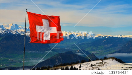 Snowy Peaks Under Bright Sky, Panoramic View Of Icy Peaks Beneath Bright Blue Sky With Scenic Trail Snowy Peaks Under Bright Sky, Panoramic View Of Icy Peaks Beneath Bright Blue Sky With Scenic Trail 135764424
