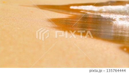 Warm Sunlight Illuminates Sandy Beaches Where Peaceful Waves Create Soothing Textures And Tranquil Ambiance Warm Sunlight Illuminates Sandy Beaches Where Peaceful Waves Create Soothing Textures And Tranquil Ambiance 135764444
