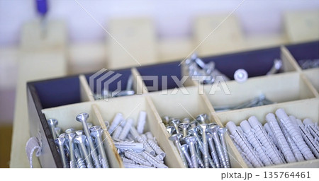 Efficiently Arranged Storage Box Containing Diverse Fastening Tools And Repair Accessories For Projects 135764461