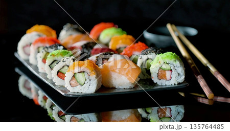 Diverse Sushi Assortment, Variety Of Sushi Types Including Nigiri And Rolls Displayed Stylishly Diverse Sushi Assortment, Variety Of Sushi Types Including Nigiri And Rolls Displayed Stylishly 135764485
