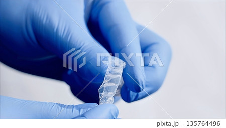 Committed Medical Specialist Diligently Finetunes Dental Devices To Enhance Comfort And Effectiveness 135764496