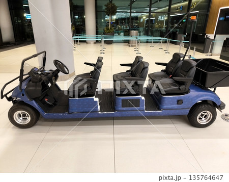 Electric car for transporting passengers at the airport Electric car for transporting passengers at the airport 135764647