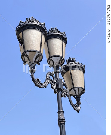 Romantic street lamp against clear blue sky Romantic street lamp against clear blue sky 135764762