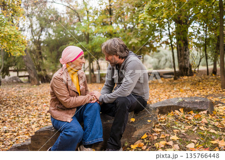 Couple holding hands, offering support during cancer journey Couple holding hands, offering support during cancer journey 135766448