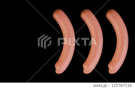 Collage of five boiled sausages, on a black background in isolation Collage of five boiled sausages, on a black background in isolation 135767116