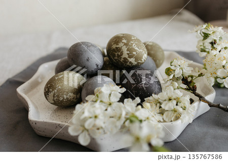 Easter holiday. Painted olive-colored eggs on a linen tablecloth. Easter decoration. Easter holiday. Painted olive-colored eggs on a linen tablecloth. Easter decoration. 135767586