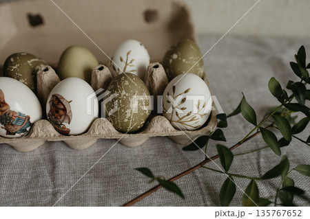 Easter holiday. Painted olive-colored eggs on a linen tablecloth. Easter decoration. Easter holiday. Painted olive-colored eggs on a linen tablecloth. Easter decoration. 135767652