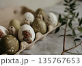 Easter holiday. Painted olive-colored eggs on a linen tablecloth. Easter decoration. 135767653