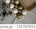 Easter holiday. Painted olive-colored eggs on a linen tablecloth. Easter decoration. 135767654