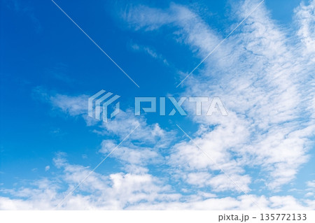Vibrant Blue Sky Canvas A Sea of White Clouds Drifting in the Azure Expanse Overhead Vibrant Blue Sky Canvas A Sea of White Clouds Drifting in the Azure Expanse Overhead 135772133