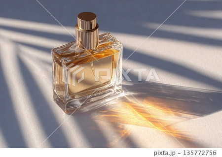 A chic cosmetic glass bottle lies on thin parallel shade lines in the rays of the sun. A copy space. A blank bottle mockup. product advertising A chic cosmetic glass bottle lies on thin parallel shade lines in the rays of the sun. A copy space. A blank bottle mockup. product advertising 135772756