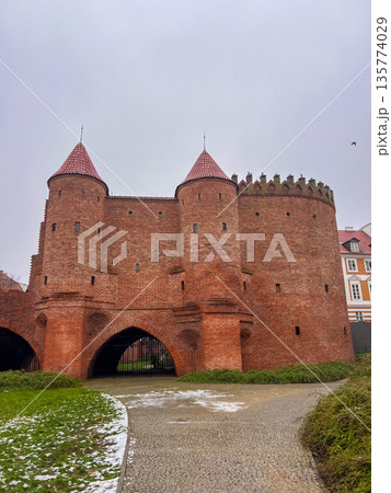 Walking around the Warsaw Barbican on a cloudy day in winter 135774029