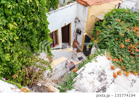 Narrow streets of Anafiotika area in ancient Athens Narrow streets of Anafiotika area in ancient Athens 135774194