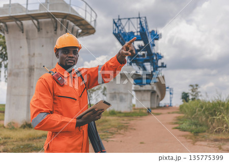 Engineer survey team checking construction project inspection work construction site Engineer survey team checking construction project inspection work construction site 135775399