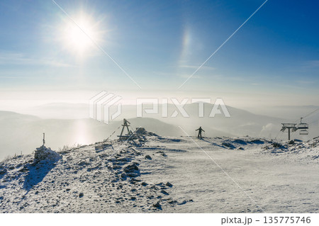 A skier admires the winter scenery. Sheregesh ski resort. cold natural landscape, activity A skier admires the winter scenery. Sheregesh ski resort. cold natural landscape, activity 135775746