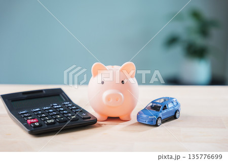 Pink piggy bank for car loan debt management and financial saving goals with calculator plus toy car helps plan personal finance budget to save money for vehicle fund or purchase 135776699