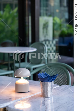 Table lamp with tissue paper on the table, in fine dining restaurant Table lamp with tissue paper on the table, in fine dining restaurant 135776841