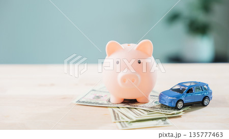 Car money piggy bank save auto insurance fuel refinance loan finance drive gas transportation cost with banknotes helps manage budget for vehicle maintenance and automobile expense 135777463