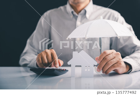 Protect your home, make sure insured, calculate financial insurance using an umbrella for complete assistance, and know your contents are always insured with this safe investment concept Protect your home, make sure insured, calculate financial insurance using an umbrella for complete assistance, and know your contents are always insured with this safe investment concept 135777492