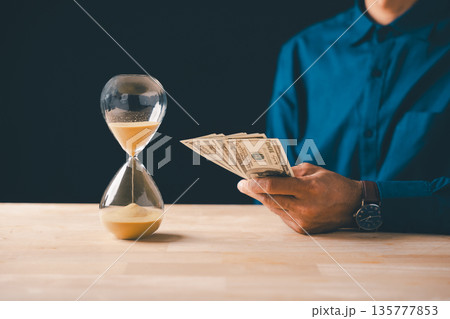 Money time hourglass shows business investment finance savings global economy, vital wealth management strategy for future financial planning and secure banking Money time hourglass shows business investment finance savings global economy, vital wealth management strategy for future financial planning and secure banking 135777853