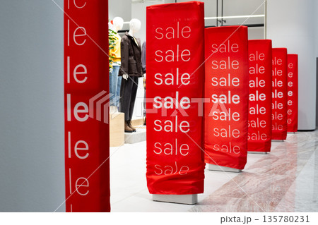 Electronic article surveillance in clothing store with covers designed for discounts. Sale advertising in store using anti theft system. Magnetic frames at exit of clothing store advertising sales Electronic article surveillance in clothing store with covers designed for discounts. Sale advertising in store using anti theft system. Magnetic frames at exit of clothing store advertising sales 135780231