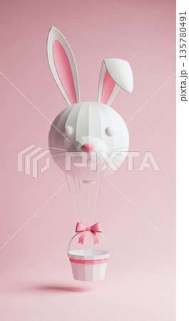 Whimsical Easter bunny hot air balloon with a gift basket floats against a soft pink background 135780491