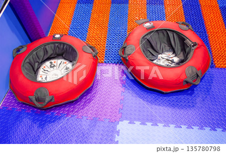 The surface of the slide is made of multi-colored material blue, red, purple . The tubes are round inflatable seats with a hole in the middle and handles on the sides, designed for a safe and exciting The surface of the slide is made of multi-colored material blue, red, purple . The tubes are round inflatable seats with a hole in the middle and handles on the sides, designed for a safe and exciting 135780798