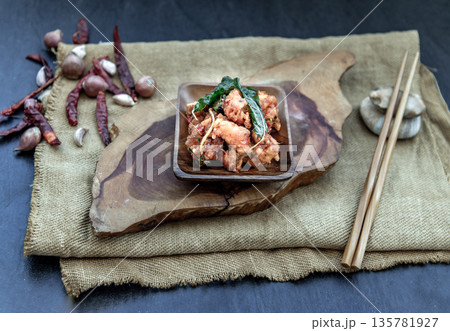 Thai Spicy food, Spicy Stir Fried Deep Fish Fillet with Herbs vegetables in wooden bowl : in Thai language called "Pad Cha ". Thai Spicy food, Spicy Stir Fried Deep Fish Fillet with Herbs vegetables in wooden bowl : in Thai language called "Pad Cha ". 135781927