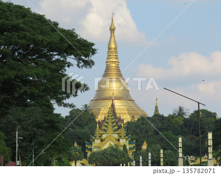 The gold dome of Shwedagon Pagoda behind trees in Yangon.JPG The gold dome of Shwedagon Pagoda behind trees in Yangon.JPG 135782071