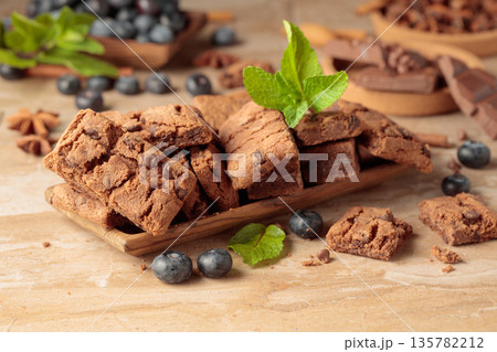 Brownie with fresh blueberries and mint. Brownie with fresh blueberries and mint. 135782212