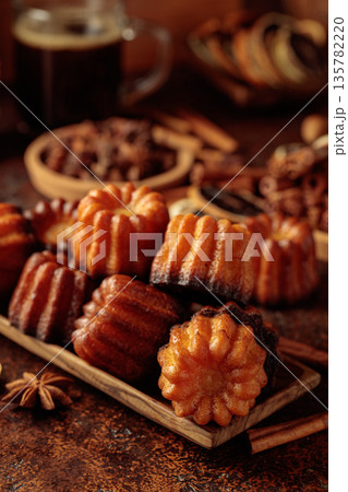 Cinnamon cakes and mug of black coffee. 135782220