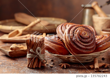 Freshly baked sweet cinnamon buns. 135782243